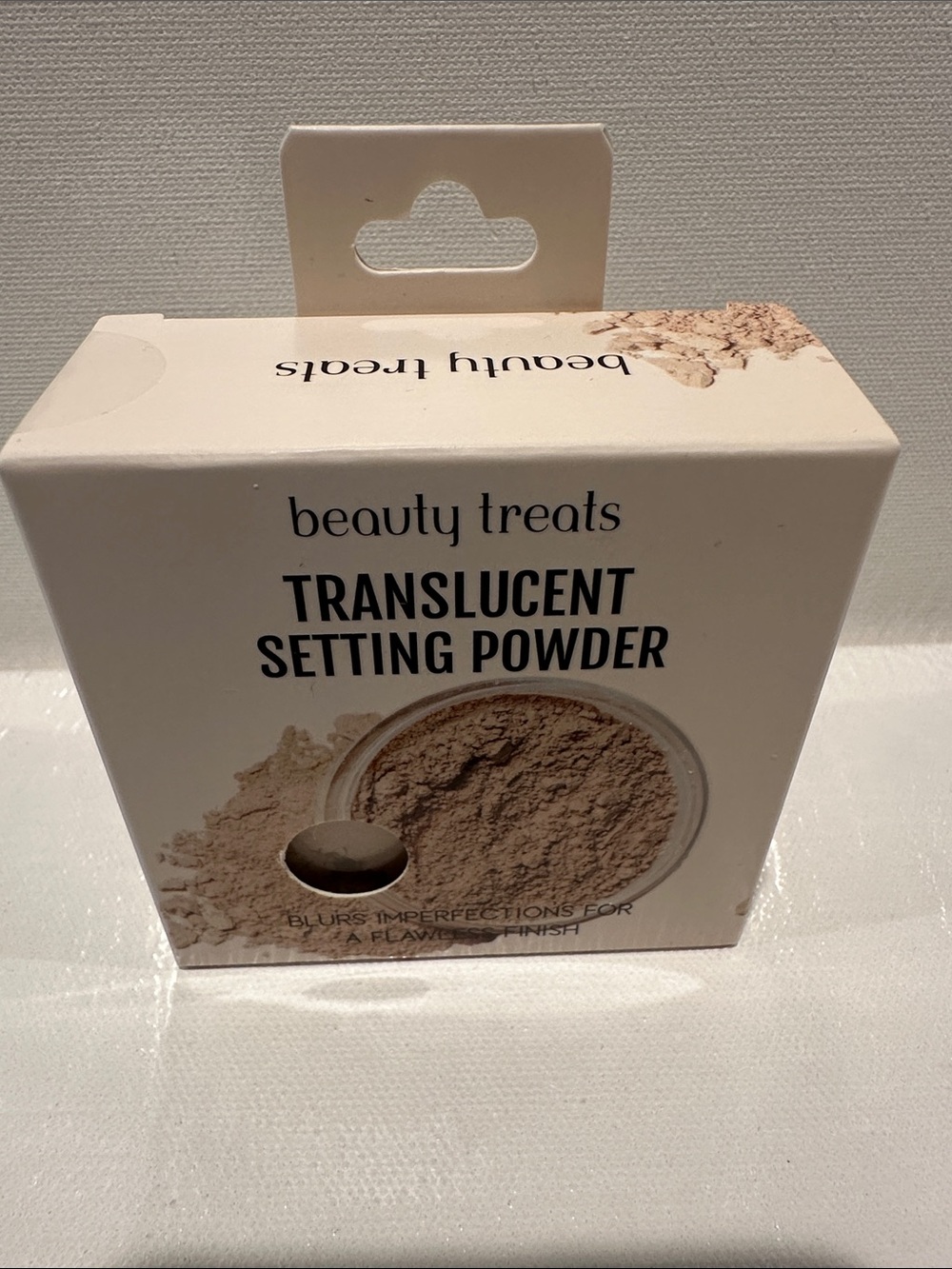 Beauty Treats Translucent Setting Powder for a flawless finish.